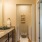 a bathroom with a door to a laundry room
