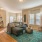 a living room with a rug and couches