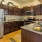 a kitchen with wooden cabinets