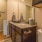 a bathroom with a door to a laundry room