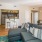 a living room with a couch and a bar