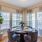 a dining room with a table and chairs