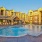 a pool in front of a row of buildings