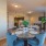a dining room with a table and chairs