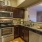 a kitchen with wooden cabinets