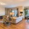 a living room with a couch and chairs