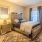 a bedroom with a bed and a chair