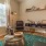 a living room with a chair and a table